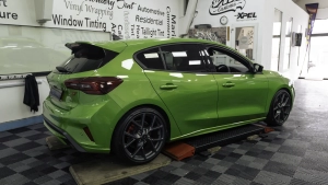 Ford Focus ST in for paint protection film application to the side skirts. Whole car photo.