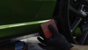 Ford Focus ST in for paint protection film application to the side skirts. Squeegee close up number 1.