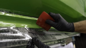 Ford Focus ST in for paint protection film application to the side skirts. Squeegee close up number 2.