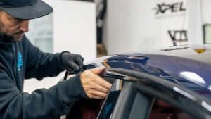 Audi S5 chrome delete. Progress photo of wrapping the top window trim. Laying the vinyl. Photo one.