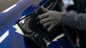 Audi S5 chrome delete. Progress photo of wrapping the rear quarter window trim. Photo one.