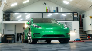 Tesla Model Y - Gloss Green Envy. Inside photo of the front of the car. Angle 4.