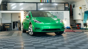 Tesla Model Y - Gloss Green Envy. Inside photo of the front of the car. Angle 2.