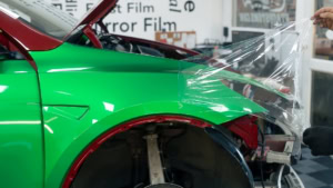 Tesla Model Y - Gloss Green Envy. Front wing progress photo 6.