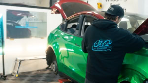 Tesla Model Y - Gloss Green Envy. Front wing progress photo 1.