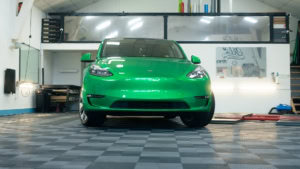 Tesla Model Y - Gloss Green Envy. Inside photo of the front of the car. Angle 5.